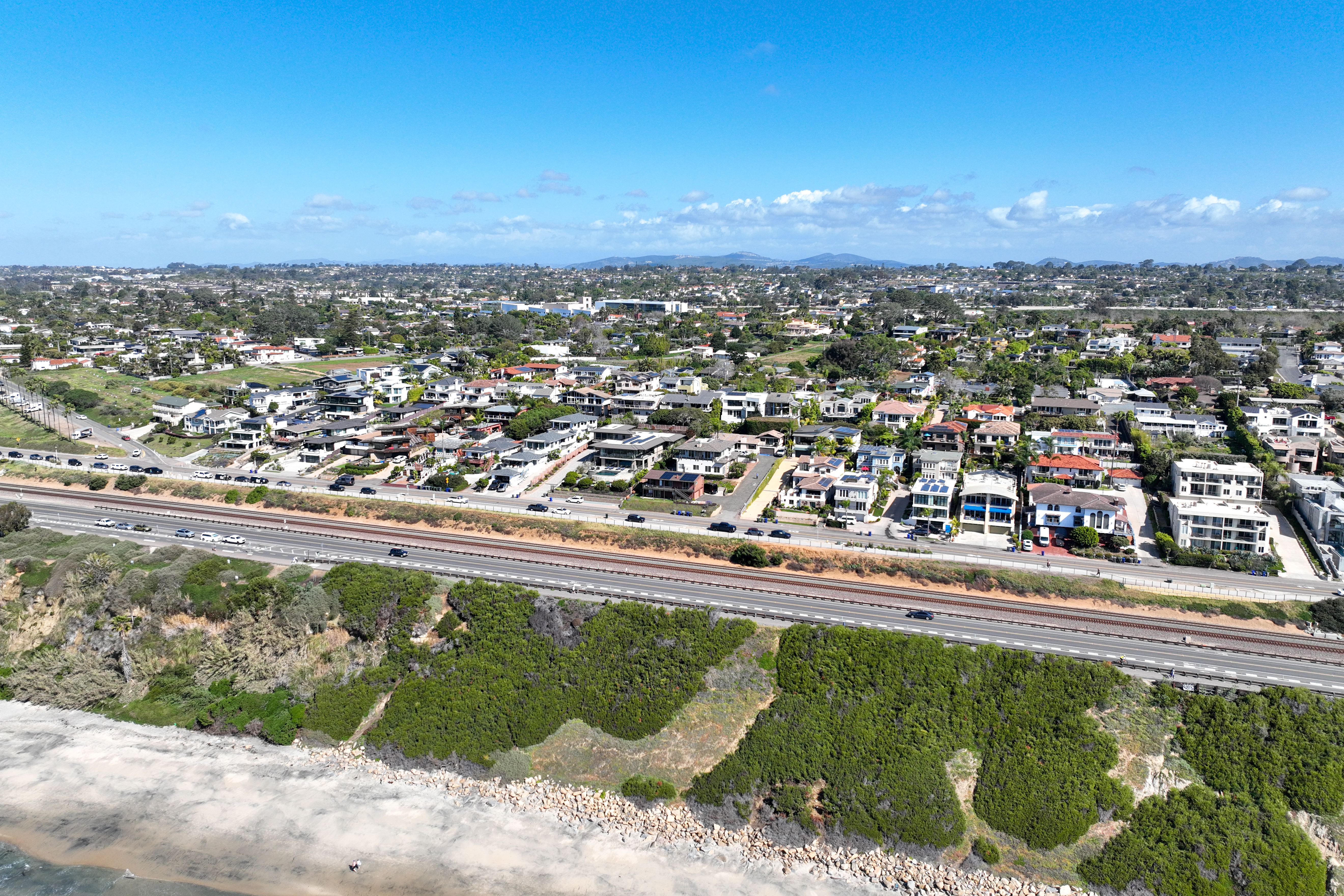 Aerial view of Encinitas coastal homes and bluffs